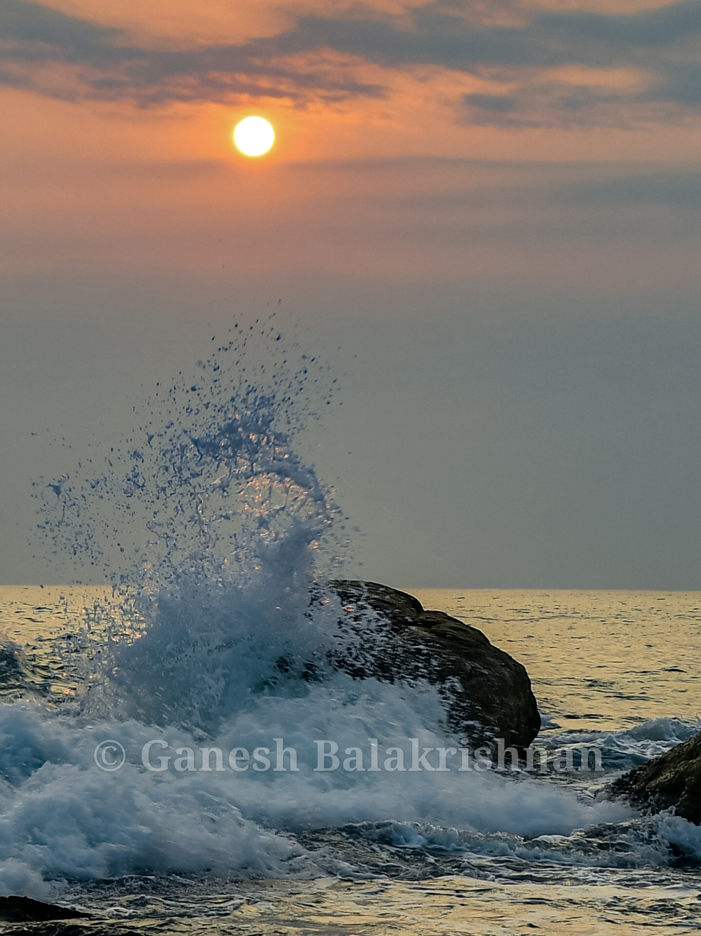 Golden Sunrise Waves Over Ocean Rocks