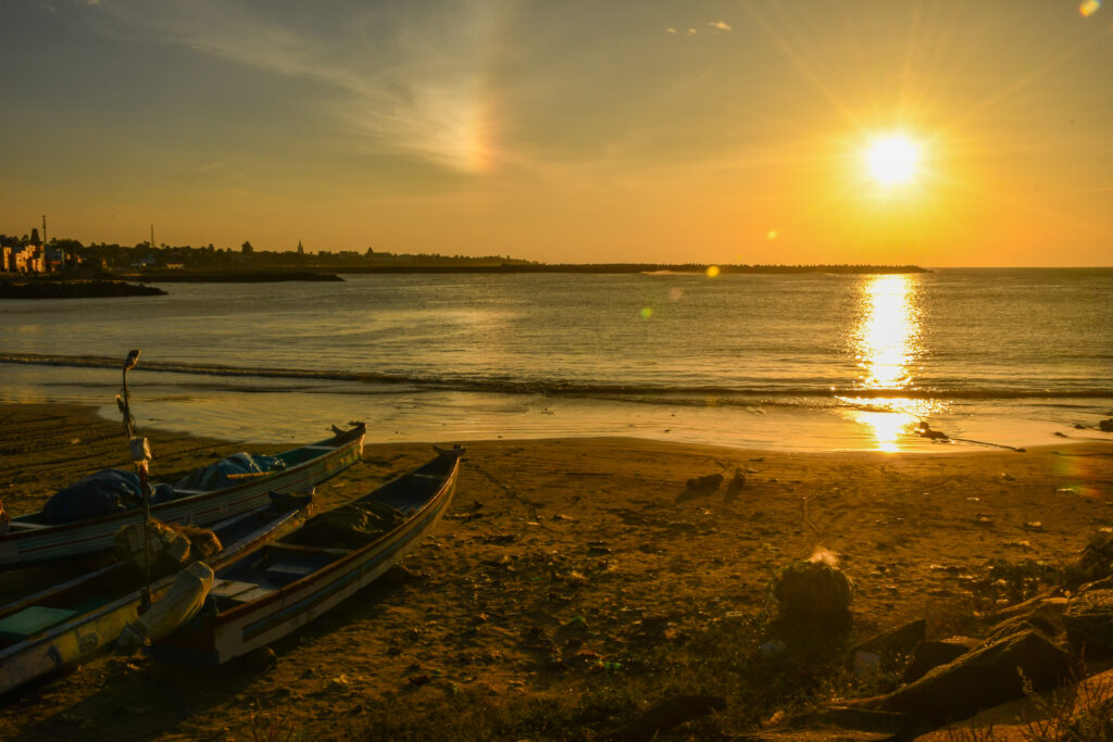Golden Sunrise over Kanyakumari Beach with Fishing Boats, Tamil Nadu, India
